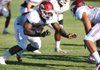 Defensive end Chris Smith (left) is one of five Arkansas defensive linemen who started at least three games last season. Arkansas is trying to improve after ranking No. 9 in the SEC in defense in 2011. 