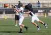 Gavin Shadrick, right, tries to stop Trey Perkins from successfully catching the ball Monday during practice at Tiger Stadium in Bentonville. Bentonville hosts Rockhurst High School of Kansas City, Mo., at 7:30 p.m. Aug. 31.