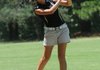 Hanna Brauburger of Bentonville High School watches a fairway shot on Tuesday Aug. 7 2012. 