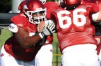 Offensive tackle Jason Peacock is the only one of six Arkansas players arrested in the spring to make it back for fall practice.