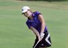 Anna Grace Lavy, a Fayetteville golfer, makes a chip shot Wednesday on the ninth hole at Paradise Valley Country during a dual meet with Rogers Heritage.