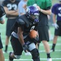 Brayden Cook, Fayetteville running back, carries the ball Tuesday during practice at Harmon Field. 