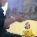 Samuel Huxel, 8, a second-grader from Farmington, smiles Thursday while listening to a story read by...
