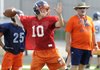 Josh Qualls, a Rogers Heritage quarterback, passes the ball Wednesday during the War Eagles’ practice at Gates Stadium in Rogers. 