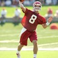 Tyler Wilson, a University of Arkansas quarterback, runs drills during practice in Fayetteville.
