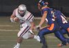 Siloam Springs Panthers running back Scout Alexander, from left, is stopped by Heritage defenders Utah Juius and Branden Uhrig at War Eagle Stadium in Rogers, Ark. on Friday, Sept. 9, 2011. 