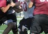 Joe Burlingame, center, a Springdale offensive lineman practices Thursday.
