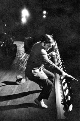 
                           No. 1: "Hound Dog"
Written by Jerry Leiber and Mike Stoller and originally recorded by "Big Mama" Thornton in 1952, "Hound Dog" made a No. 1 hit for Elvis in August 1956. Initially released as the B-side to "Don't Be Cruel," each song made it to the top of the charts. Rolling Stone magazine ranks it No. 19 on its list of The 500 Greatest Songs of All Time.

***

Elvis Presley performs in Miami, Fla., on Aug. 3, 1956.