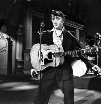 
                           No. 8: "Love Me Tender"
Based on melody of the Civil War-era tune "Aura Lee," "Love Me Tender" was performed on "The Ed Sullivan Show" in September 1956, about a month before its companion "Love Me Tender" movie was released. Advance orders flooded in, and the single went gold even before its release. It ranked  No. 444 on on Rolling Stone's list of The 500 Greatest Songs of All Time.

***

Elvis Presley performs in New York City July 1, 1956, on "The Steve Allen Show."