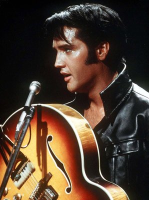 
                           No. 3: "Suspicious Minds" soared to No. 1 on the Billboard Hot 100 Chart in November 1969, his 17th and final hit to reach the top of the charts.
No. 91 on "Rolling Stone" magazine's list of The 500 Greatest Songs of All Time.

***

In this 1968 file photo, Elvis Presley holds his semi-acoustic guitar during a concert. (AP Photo)