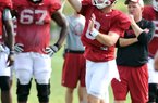 Arkansas quarterback Tyler Wilson continued to throw well in practice Wednesday, completing 15 of 18 passes in the morning and finishing the night session by completing 18 of 24 passes. 
