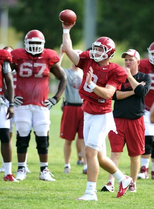 Arkansas quarterback Tyler Wilson continued to throw well in practice Wednesday, completing 15 of 18 passes in the morning and finishing the night session by completing 18 of 24 passes. 