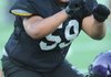 Giovanni Negrete, a Fayetteville senior defensive lineman, works through drills during practice at Harmon Field.