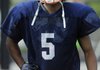 Forrest Johnson, a Rogers Heritage wide receiver, takes a break between reps during practice at Gates Stadium in Rogers.