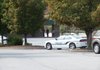 The manager of Carmike Sugar Creek 10 in Bella Vista enters the movie theater after police secured it Friday morning following a threat called into the company’s corporate office. Nobody was inside the building at the time, and police found nothing suspicious.