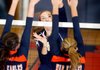 Emily Kurtz, left, Rogers Heritage junior, and sophomore Connor McNulty block a shot Tuesday by Shiloh Christian’s Brittany Butler at Heritage High School.