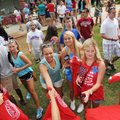 University Of Arkansas freshmen grab free Tshirts as they leave the new student welcome event Sunday...