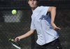 Fayetteville’s Reed Churchill returns a shot against Bentonville’s Dylan Deluca during the finals of the 7A West Conference Tennis Tournament on Oct. 6 at Memorial Park in Bentonville.