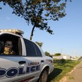Patrolman Mike Anderson with the Lincoln Police Department watches traffic Tuesday near the new high...