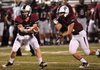 Will Whatley, left, of Springdale hands off to Colton Greenwood on Tuesday at Bulldog Stadium as the Bulldogs took on Mountain Home as part of a four-game scrimmage with Fort Smith Northside and Siloam Springs.