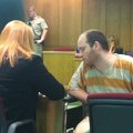 Nathan Chism, 32, speaks with his attorney Marianne Hudson before he was sentenced to 45 years in pr...