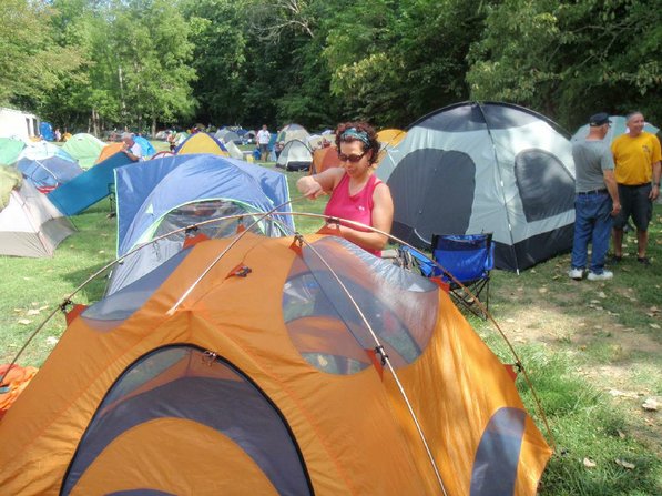 
                           Rumblers sleep in tents at the overnight towns. Lynn Peters of Wisconsin sets her tent up during the stop at Bonnots Mill, Mo.         