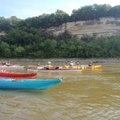 Paddlers travel beside bluffs on the Missouri River.         
