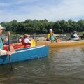 Rex Klein of Chicago, third from right, is the enthusiastic leader of the Great River Rumble.       ...