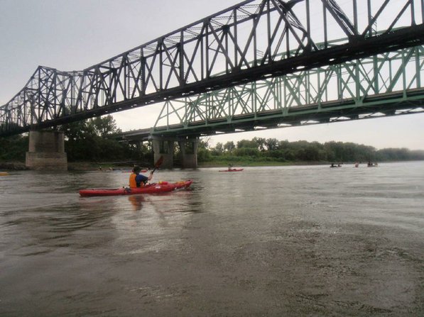 
                           The last day of the Great River Rumble on Aug. 4 brought welcome rain during the morning. Here paddlers travel under bridges near St. Charles, Mo., not far from the Missouri River's confluence with the Mississippi.        