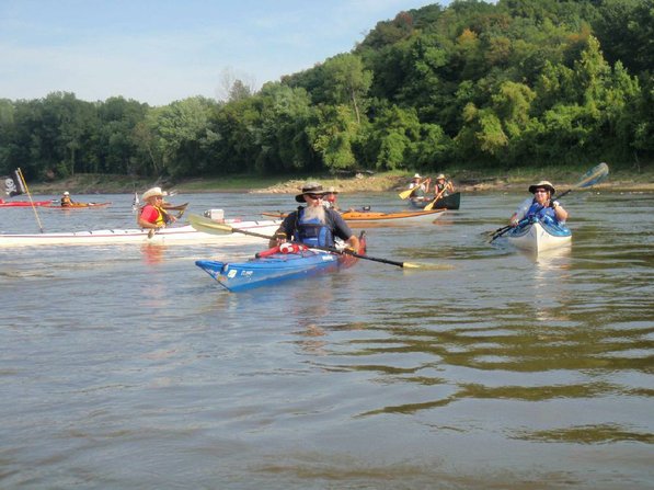 
                           Gary Jean of Virginia, left, and Dave Van Dyne of Kansas City, center, head down the Missouri River on the Great River Rumble.