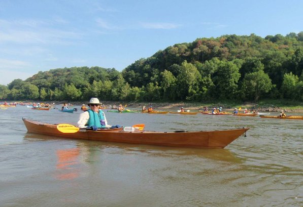 
                           Marv Leister of Fayetteville floats down the Missouri River on the Great River Rumble. Leister paddled a kayak he built himself.       