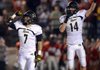 STAFF PHOTO MARC F. HENNING -- Bentonville kicker Dillon Wade, left, and holder Trey Perkins celebrate Wade's 39-yard field goal with one second left on the clock in the Tigers' scrimmage Friday, Aug. 24, 2012, against Tulsa Union at Union-Tuttle Stadium in Tulsa, Okla.