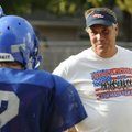 Decatur coach Shane Holland talks with players during a preseason practice. 
