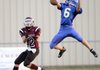 Evan Owens, right, a Decatur defensive back, breaks up a pass to Gentry receiver Stone Faulkenberry during a scrimmage Thursday.