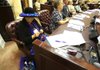 Arkansas Democrat-Gazette/ STATON BREIDENTHAL --8/23/12--Lee Carlson of Mt. Home knits a hat band Thursday as she listens to bills being presented on the House floor during the biennial Silver-Haired Legislature. The session is a mock legislature of delegates 60 years of age and older that convenes every two years.