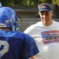 Shane Holland, the Decatur football coach, talks with his players during a recent practice.