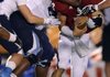 Josh Frazier, Springdale Har-Ber defensive lineman, sacks Owasso, Okla., quarterback Jaylen Lower during the Wildcats’ scrimmage Friday against the Rams at Union-Tuttle Stadium in Tulsa, Okla.