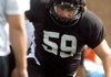 Justin Fair, Bentonville defensive lineman, runs through drills Aug. 8 during practice inside Tiger Stadium.