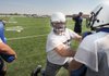 Ty Harrison, a Springdale Har-Ber offensive lineman, goes through drills Aug. 7 during football practice.