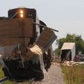 Remnants of a trailer from a tractor-trailer rig stick to an Arkansas & Missouri Railroad locomotive...