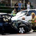 Springdale Fire Department members tend to a Dodge Neon on South Thompson Street on Monday, Aug. 27,...