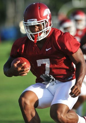 Arkansas running back Knile Davis ran five live plays in Friday’s mock game and fumbled after hitting the turf on his first carry. “Got the little fumble out of the way,” Davis said. “Glad it didn’t happen the first game.” Video available at arkansasonline.com/videos. 