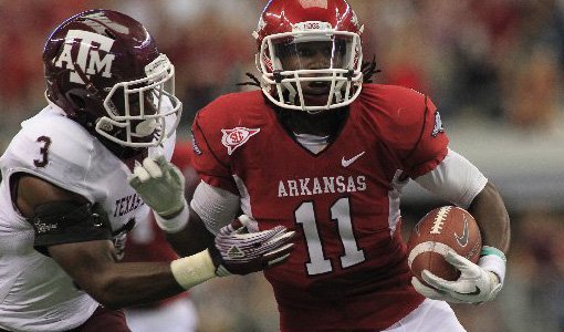 Arkansas Democrat-Gazette/BENJAMIN KRAIN --10/1/11-- Texas A&M defensive back Steven Campbell forces a fumble from Arkansas wide receiver Cobi Hamilton near the end zone during the fourth quarter of the Southwest Classic at Cowboys Stadium in Arlington, Texas. The two schools will resume their rivalry in Dallas suburb in 2014. 