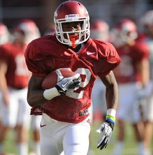 NWA Media/ANDY SHUPE -- Arkansas running back Nate Holmes carries the ball Saturday, Aug. 11, 2012, prior to the start of the Hogs' scrimmage in Razorback Stadium.