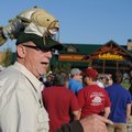 Randy Foote, outfitter at Cabela’s, talks Thursday with shoppers in line as they wait for the store’...