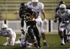 Tearris Wallace, Bentonville running back, breaks away Friday for a big gain during the third quarter of the Tigers’ season opener against Kansas City (Mo.) Rockhurst at Tiger Stadium in Bentonville. 