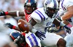 Central Arkansas running back Jackie Hinton (5) fumbles after being hit by Mississippi’s E.J. Epperson in the first half of the Rebels’ 49-27 victory Saturday in Oxford, Miss.
