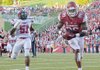 Arkansas tight end Chris Gragg scores a second-quarter touchdown on a 30-yard pass from quarterback Tyler Wilson as Jacksonville State defender Rashad Smith falls behind. The touchdown pulled the Razorbacks into a 14-14 tie with the Gamecocks. Gragg finshed the game with 7 catches for 110 yards and 2 touchdowns. 