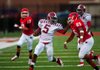 #5 Walters Ashley of Pine Bluff picks up a first down and stiff-arms #25 Gabe Sopshire of Northside on Friday.