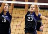 Paige Gocke, left, a Fayetteville senior, and junior Cassidy Ginger attempt to block a Siloam Springs shot during the first set of a match Tuesday at Panther Arena in Siloam Springs.
